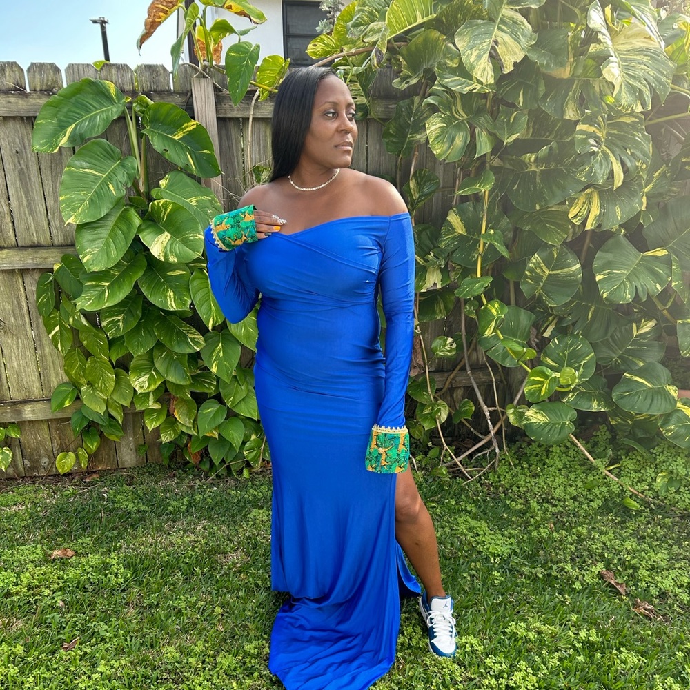 Blue off shoulder dress, long sleeve. With custom made crust cuffs.